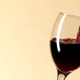 Glass of red wine being poured from the bottle